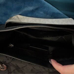 Black and white Michael kors cross body purse with chain strap